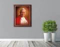 Obraz religijny na płótnie Święty Jan Paweł II w ramie ze złotym paskiem