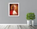 Obraz religijny na płótnie Święty Jan Paweł II w białej ramie