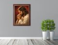 Obraz religijny na płótnie Jezus Chrystus w ramie drewnianej ze złotym paskiem